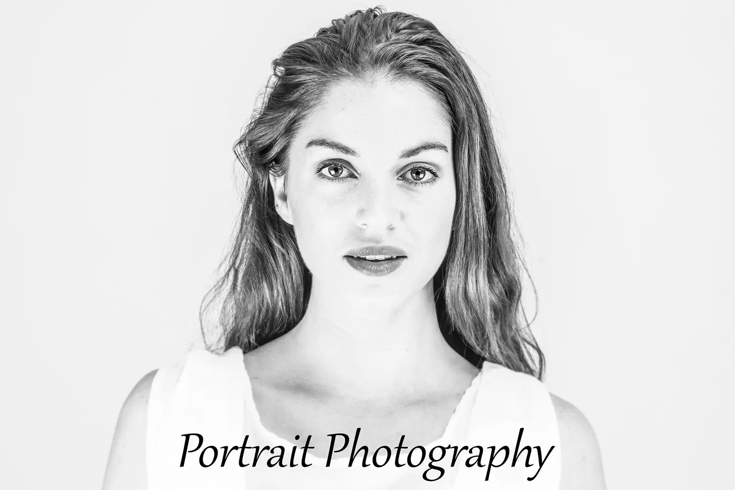 Black and white headshot of attractive young woman