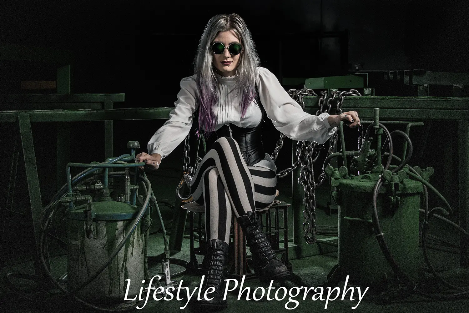 Steampunk woman in goggles and industrial setting